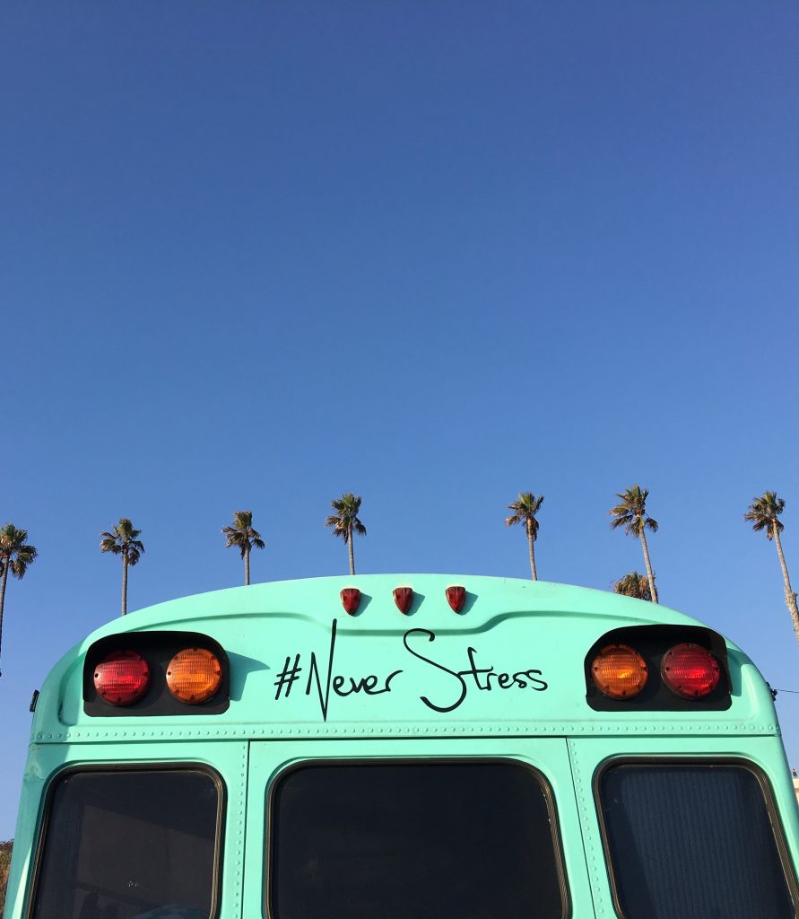 Bus with logo "Never Stress"